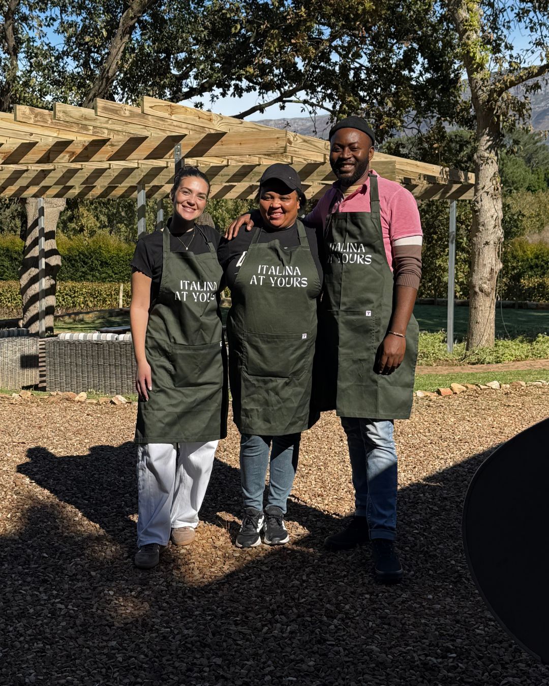 The Italina At Yours crew in branded aprons at a Winelands event